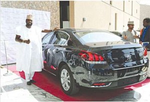 Kunle-Afolayan-with-his-new-Peugeot-508